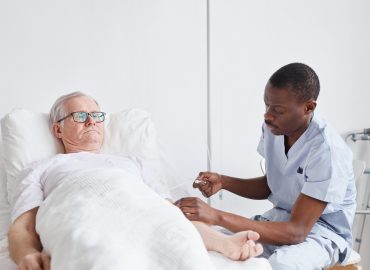 Male Nurse Caring for Patient