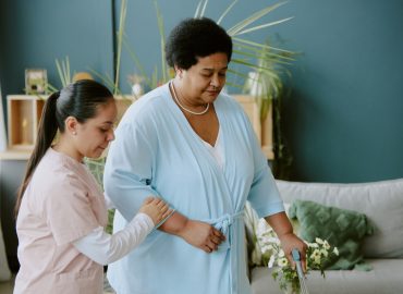 Nurse Helping Elderly Woman with Walking